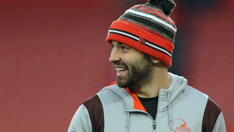 Browns quarterback Baker Mayfield laughs as he watches his teammates warm up before a game against the Cincinnati Bengals, Sunday, Jan. 9, 2022, in Cleveland.

Baker Pregame 2