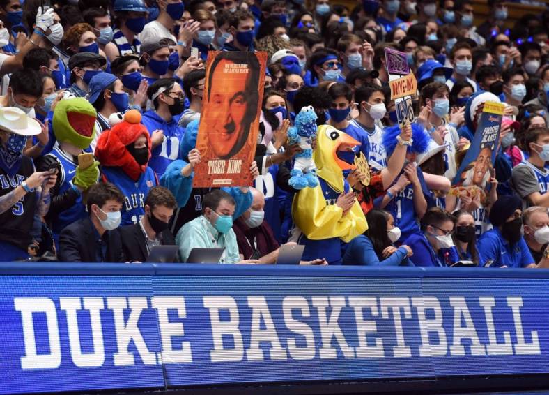 Jan 25, 2022; Durham, North Carolina, USA; Duke Blue Devils fans hold up signs during the first half against the Clemson Tigers at Cameron Indoor Stadium. Mandatory Credit: Rob Kinnan-USA TODAY Sports