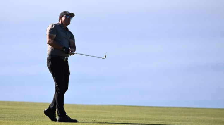 Jan 27, 2022; San Diego, California, USA; Phil Mickelson plays his second shot on the fourth hole during the first round of the Farmers Insurance Open golf tournament at Torrey Pines Municipal Golf Course - South Course. Mandatory Credit: Orlando Ramirez-USA TODAY Sports