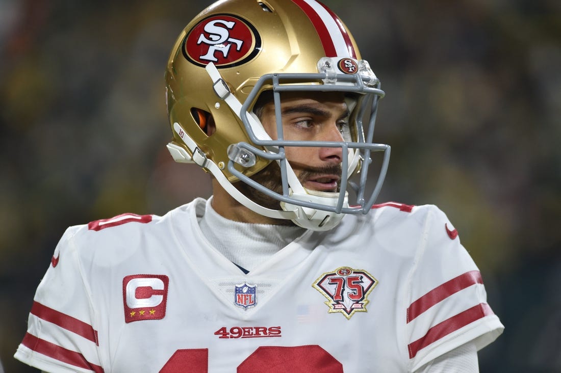 Jan 22, 2022; Green Bay, Wisconsin, USA; San Francisco 49ers quarterback Jimmy Garoppolo (10) in action against the Green Bay Packers during a NFC Divisional playoff football game at Lambeau Field. Mandatory Credit: Jeffrey Becker-USA TODAY Sports