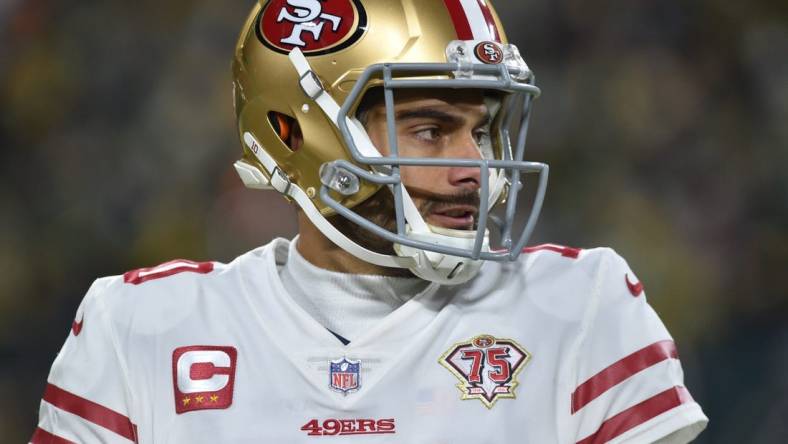 Jan 22, 2022; Green Bay, Wisconsin, USA; San Francisco 49ers quarterback Jimmy Garoppolo (10) in action against the Green Bay Packers during a NFC Divisional playoff football game at Lambeau Field. Mandatory Credit: Jeffrey Becker-USA TODAY Sports