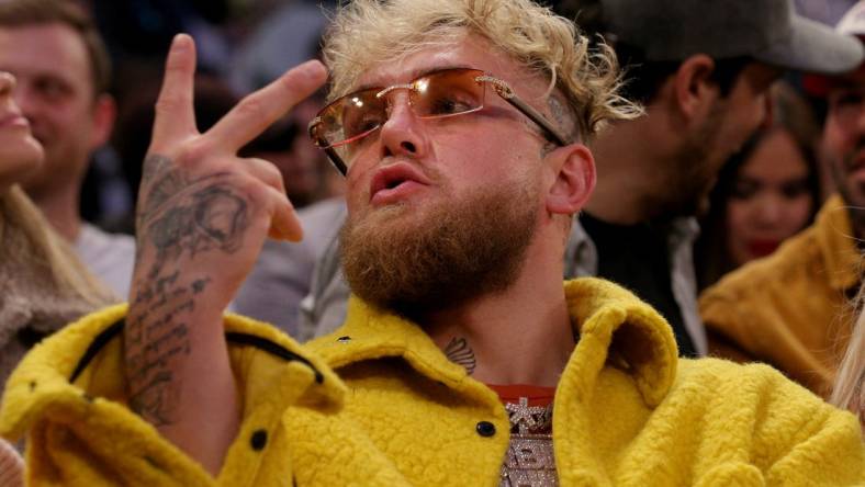 Feb 2, 2022; New York, New York, USA; American boxer Jake Paul gestures at a fan during the third quarter between the New York Knicks and the Memphis Grizzlies at Madison Square Garden. Mandatory Credit: Brad Penner-USA TODAY Sports