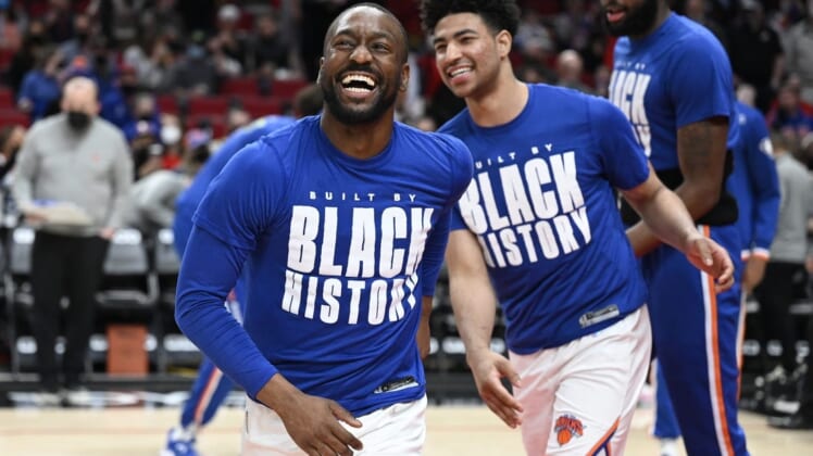 Feb 12, 2022; Portland, Oregon, USA; New York Knicks guard Kemba Walker (8) laughs as he is introduced before a game against the Portland Trail Blazers at Moda Center. The Trail Blazers won the game 112-103. Mandatory Credit: Troy Wayrynen-USA TODAY Sports