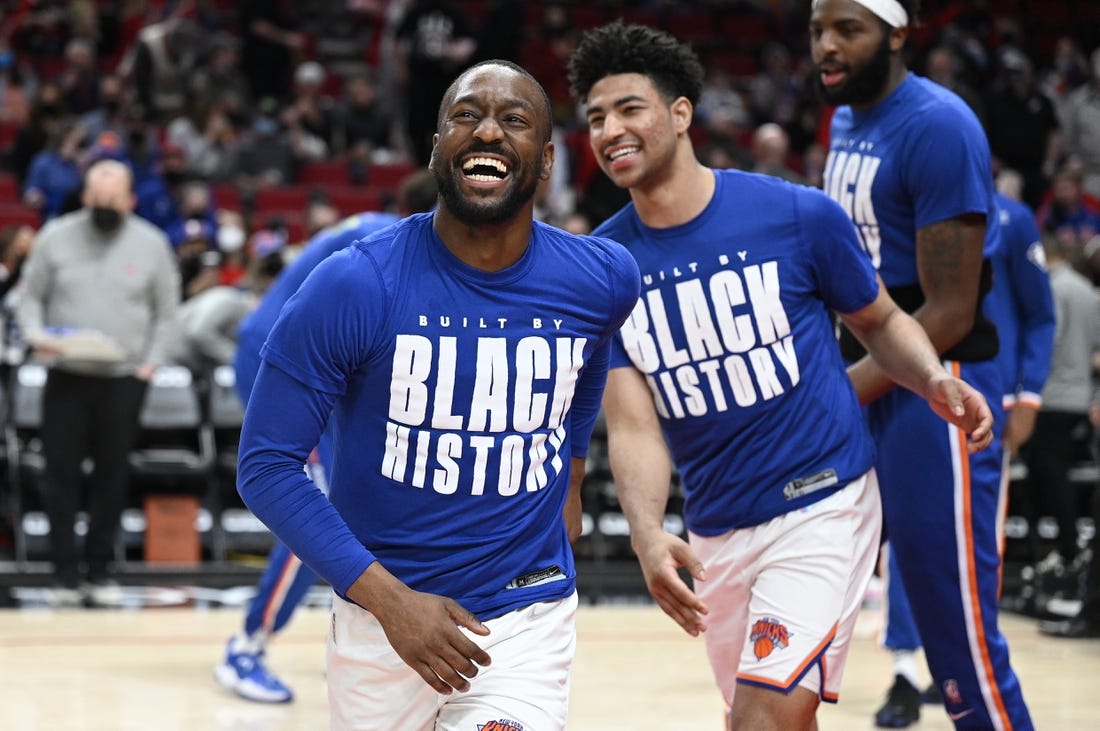 Feb 12, 2022; Portland, Oregon, USA; New York Knicks guard Kemba Walker (8) laughs as he is introduced before a game against the Portland Trail Blazers at Moda Center. The Trail Blazers won the game 112-103. Mandatory Credit: Troy Wayrynen-USA TODAY Sports