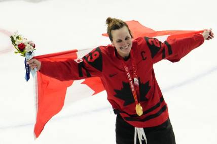 Feb 17, 2022; Beijing, China; Team Canada forward Marie-Philip Poulin (29) celebrates after the medals ceremony during the Beijing 2022 Olympic Winter Games at Wukesong Sports Centre. Mandatory Credit: Rob Schumacher-USA TODAY Sports