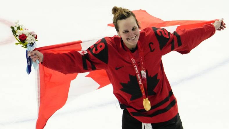 Feb 17, 2022; Beijing, China; Team Canada forward Marie-Philip Poulin (29) celebrates after the medals ceremony during the Beijing 2022 Olympic Winter Games at Wukesong Sports Centre. Mandatory Credit: Rob Schumacher-USA TODAY Sports