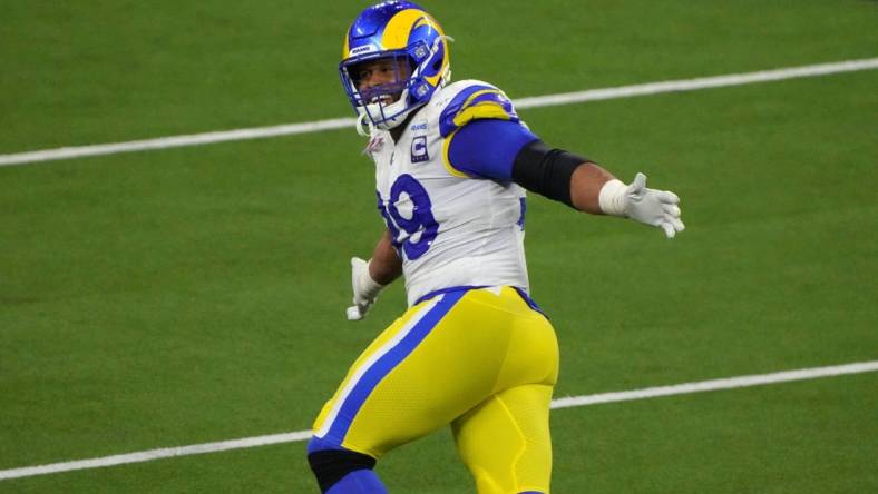 Feb 13, 2022; Inglewood, California, USA; Los Angeles Rams defensive end Aaron Donald (99) celebrates in the fourth quarter against the Cincinnati Bengals in Super Bowl LVI at SoFi Stadium. The Rams defeated the Bengals 23-20. Mandatory Credit: Kirby Lee-USA TODAY Sports