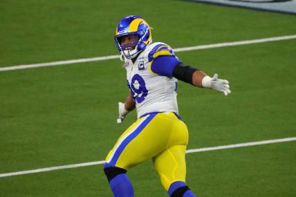 Feb 13, 2022; Inglewood, California, USA; Los Angeles Rams defensive end Aaron Donald (99) celebrates in the fourth quarter against the Cincinnati Bengals in Super Bowl LVI at SoFi Stadium. The Rams defeated the Bengals 23-20. Mandatory Credit: Kirby Lee-USA TODAY Sports