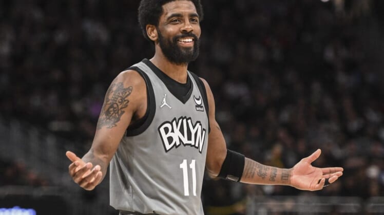Feb 26, 2022; Milwaukee, Wisconsin, USA; Brooklyn Nets guard Kyrie Irving (11) reacts in the fourth quarter against the Milwaukee Bucks at Fiserv Forum. Mandatory Credit: Benny Sieu-USA TODAY Sports