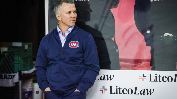 Mar 3, 2022; Calgary, Alberta, CAN; Montreal Canadiens head coach Martin St-Louis on his bench during the warmup period against the Calgary Flames at Scotiabank Saddledome. Mandatory Credit: Sergei Belski-USA TODAY Sports