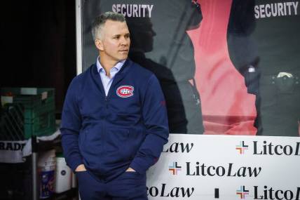 Mar 3, 2022; Calgary, Alberta, CAN; Montreal Canadiens head coach Martin St-Louis on his bench during the warmup period against the Calgary Flames at Scotiabank Saddledome. Mandatory Credit: Sergei Belski-USA TODAY Sports