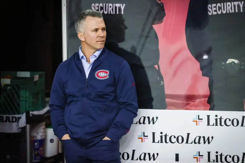 Mar 3, 2022; Calgary, Alberta, CAN; Montreal Canadiens head coach Martin St-Louis on his bench during the warmup period against the Calgary Flames at Scotiabank Saddledome. Mandatory Credit: Sergei Belski-USA TODAY Sports
