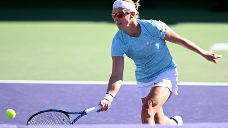 Mar 8, 2022; Indian Wells, CA, USA;  Kirsten Flipkens (BEL) hits a shot during her match against Catherine McNally (USA) at the BNP Paribas Open at Indian Wells Tennis Garden. Mandatory Credit: Jayne Kamin-Oncea-USA TODAY Sports
