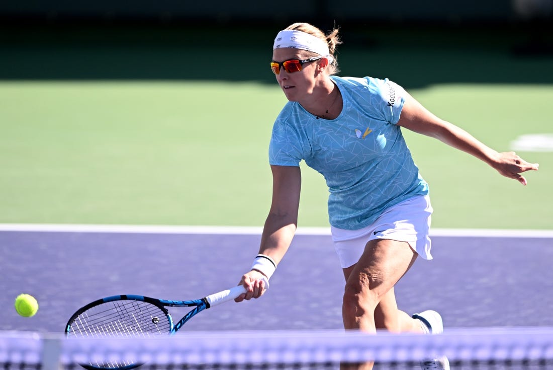 Mar 8, 2022; Indian Wells, CA, USA;  Kirsten Flipkens (BEL) hits a shot during her match against Catherine McNally (USA) at the BNP Paribas Open at Indian Wells Tennis Garden. Mandatory Credit: Jayne Kamin-Oncea-USA TODAY Sports