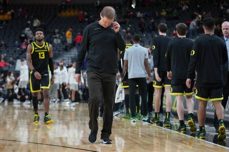 Mar 10, 2022; Las Vegas, NV, USA; Oregon Ducks head coach Dana Altman walks off the court after the Ducks were defeated by the Colorado Buffaloes 80-69 at T-Mobile Arena. Mandatory Credit: Stephen R. Sylvanie-USA TODAY Sports