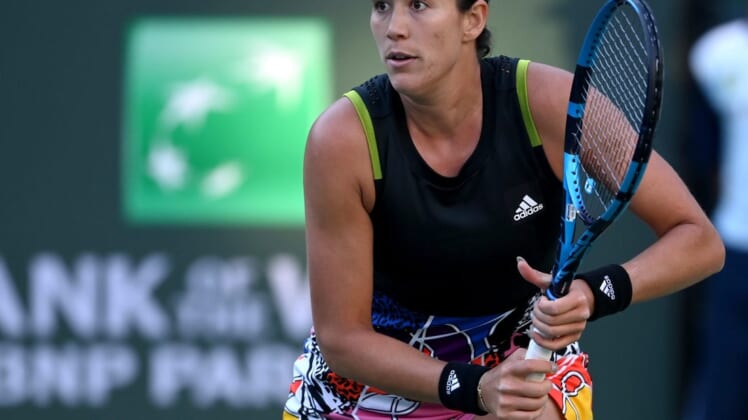 Mar 11, 2022; Indian Wells, CA, USA; Garbine Muguruza (ESP) hits a shot against Alison Riske (USA) in her 2nd round match at the BNP Paribas Open at the Indian Wells Tennis Garden. Mandatory Credit: Jayne Kamin-Oncea-USA TODAY Sports