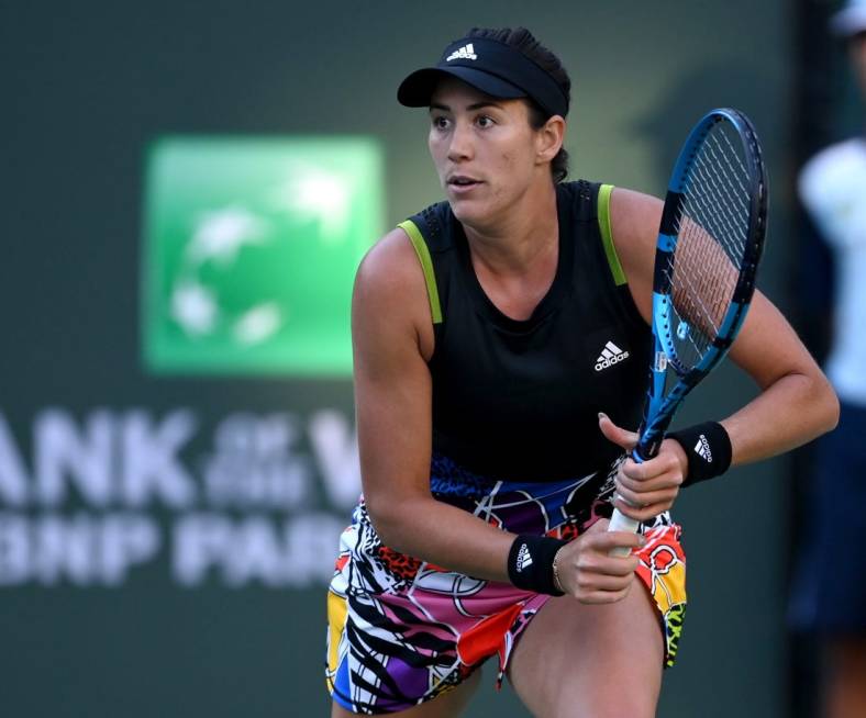 Mar 11, 2022; Indian Wells, CA, USA; Garbine Muguruza (ESP) hits a shot against Alison Riske (USA) in her 2nd round match at the BNP Paribas Open at the Indian Wells Tennis Garden. Mandatory Credit: Jayne Kamin-Oncea-USA TODAY Sports