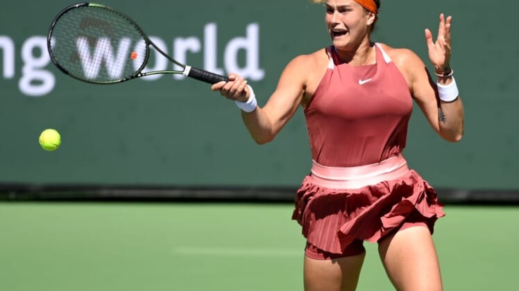 Mar 12, 2022; Indian Wells, CA, USA; Aryana Sabalenka (BEL) hits a shot in her 2nd round match against Jasmine Paolini (ITA) at the BNP Paribas open at the Indian Wells Tennis Garden. Mandatory Credit: Jayne Kamin-Oncea-USA TODAY Sports