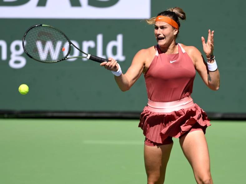 Mar 12, 2022; Indian Wells, CA, USA; Aryana Sabalenka (BEL) hits a shot in her 2nd round match against Jasmine Paolini (ITA) at the BNP Paribas open at the Indian Wells Tennis Garden. Mandatory Credit: Jayne Kamin-Oncea-USA TODAY Sports