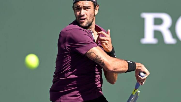 Mar 16, 2022; Indian Wells, CA, USA; Matteo Berrettini (ITA) hits a shot during his fourth round match against Miomir Kecmanovic (not pictured) at the BNP Paribas Open at the Indian Wells Tennis Garden. Mandatory Credit: Jayne Kamin-Oncea-USA TODAY Sports