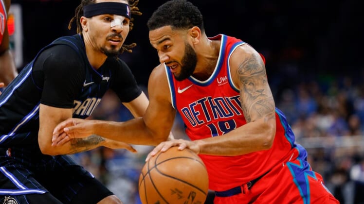 Mar 17, 2022; Orlando, Florida, USA;  Detroit Pistons guard Cory Joseph (18) drives to the basket past Orlando Magic guard Cole Anthony (50) in the first quarter at Amway Center. Mandatory Credit: Nathan Ray Seebeck-USA TODAY Sports