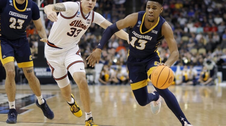 Mar 18, 2022; Pittsburgh, PA, USA; Chattanooga Mocs guard Malachi Smith (13) drives past Illinois Fighting Illini forward Coleman Hawkins (33) in the first half during the first round of the 2022 NCAA Tournament at PPG Paints Arena. Mandatory Credit: Geoff Burke-USA TODAY Sports