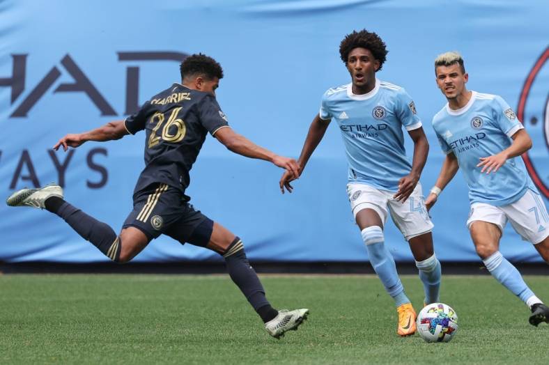 Mar 19, 2022; New York, New York, USA; Philadelphia Union defender Nathan Harriel (26) plays the ball against New York City forward Talles Magno (43) and midfielder Alfredo Morales (7) during the second half at Yankee Stadium. Mandatory Credit: Vincent Carchietta-USA TODAY Sports
