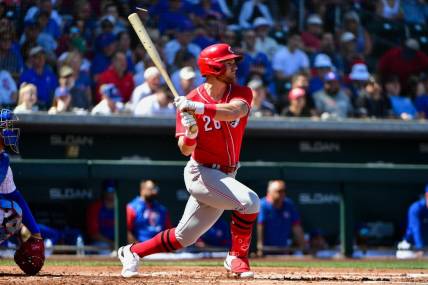 Mar 21, 2022; Mesa, Arizona, USA; Cincinnati Reds designated hitter Jake Bauers (26) singles in the second inning against the Chicago Cubs during spring training at Sloan Park. Mandatory Credit: Matt Kartozian-USA TODAY Sports