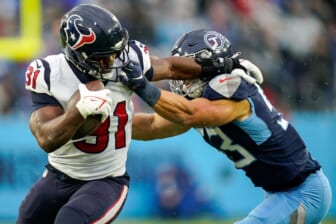Houston Texans running back David Johnson (31) takes a hit from Tennessee Titans linebacker Dylan Cole (53) during the second quarter at Nissan Stadium in Nashville, Tenn., Sunday, Nov. 21, 2021.Titans Texans 112121 Aan 012