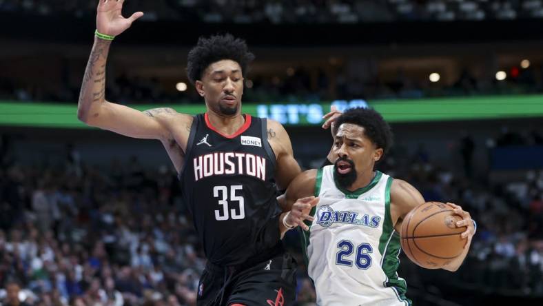 Mar 23, 2022; Dallas, Texas, USA;  Dallas Mavericks guard Spencer Dinwiddie (26) drives to the basket as Houston Rockets center Christian Wood (35) defends during the first quarter at American Airlines Center. Mandatory Credit: Kevin Jairaj-USA TODAY Sports