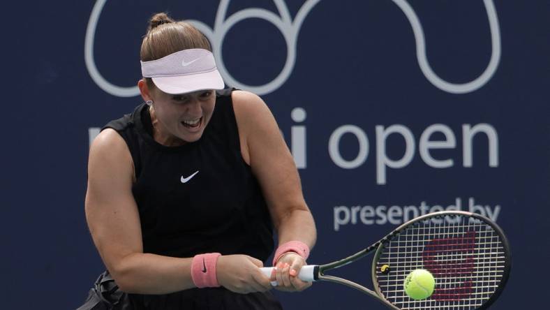 Mar 25, 2022; Miami Gardens, FL, USA; Jelena Ostapenko (LAT) hits a backhand against Shelby Rogers (USA) (not pictured) in a second round women's match in the Miami Open at Hard Rock Stadium. Mandatory Credit: Geoff Burke-USA TODAY Sports