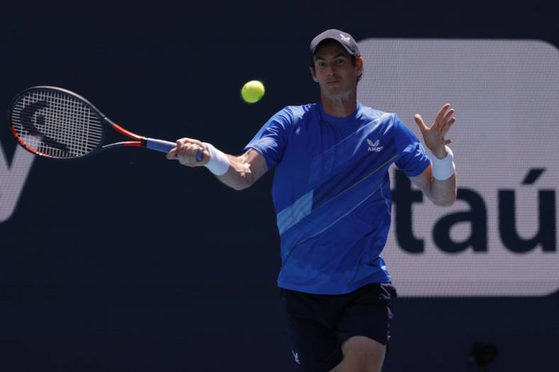 Mar 26, 2022; Miami Gardens, FL, USA; Andy Murray (GBR) hits a forehand against Daniil Medvedev (not pictured) in a second round men's singles match in the Miami Open at Hard Rock Stadium. Mandatory Credit: Geoff Burke-USA TODAY Sports