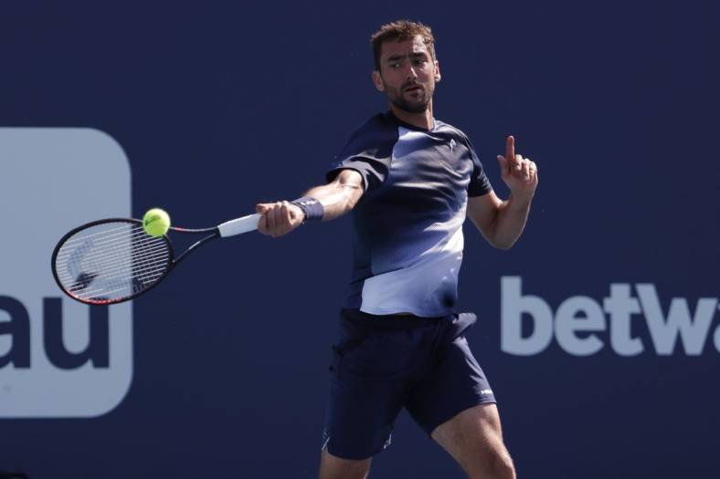 Mar 28, 2022; Miami Gardens, FL, USA; Marin Cilic (CRO) hits a forehand against Carlos Alcaraz (ESP)(not pictured) in a third round men's singles match in the Miami Open at Hard Rock Stadium. Mandatory Credit: Geoff Burke-USA TODAY Sports