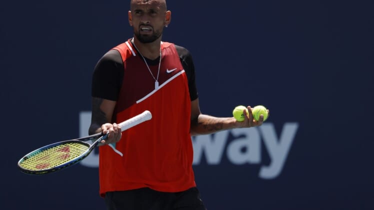 Mar 29, 2022; Miami Gardens, FL, USA; Nick Kyrgios (AUS) talks to the crowd between points against Jannik Sinner (ITA)(not pictured) in a fourth round men's singles match in the Miami Open at Hard Rock Stadium. Mandatory Credit: Geoff Burke-USA TODAY Sports