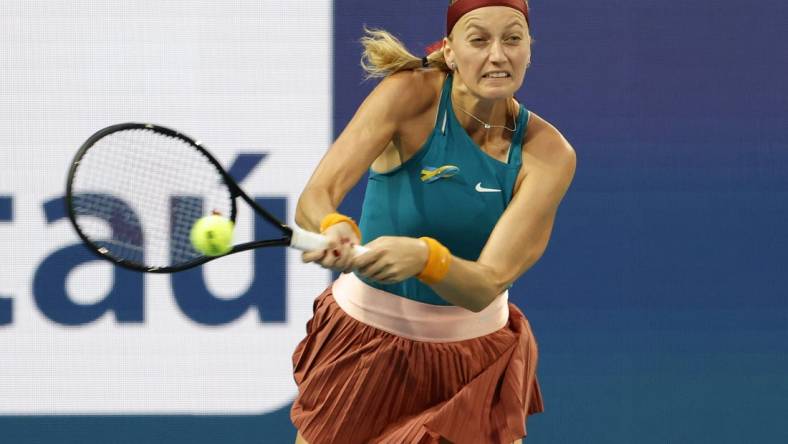 Mar 30, 2022; Miami Gardens, FL, USA; Petra Kvitova (CZE) hits a backhand against Iga Swiatek (POL)(not pictured) in a women's singles quarterfinal match in the Miami Open at Hard Rock Stadium. Mandatory Credit: Geoff Burke-USA TODAY Sports