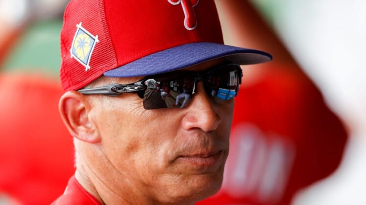 Mar 31, 2022; Clearwater, Florida, USA; Philadelphia Phillies manager Joe Girardi  (25) looks on from the dugout in the sixth inning against the New York Yankees during spring training at BayCare Ballpark. Mandatory Credit: Nathan Ray Seebeck-USA TODAY Sports