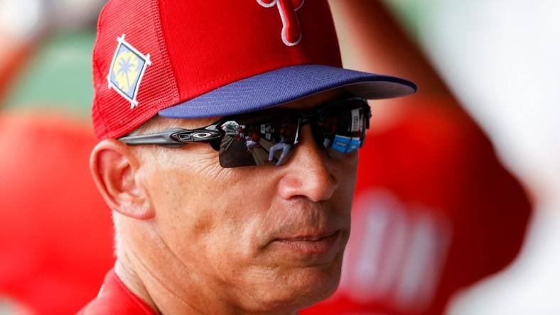 Mar 31, 2022; Clearwater, Florida, USA; Philadelphia Phillies manager Joe Girardi  (25) looks on from the dugout in the sixth inning against the New York Yankees during spring training at BayCare Ballpark. Mandatory Credit: Nathan Ray Seebeck-USA TODAY Sports