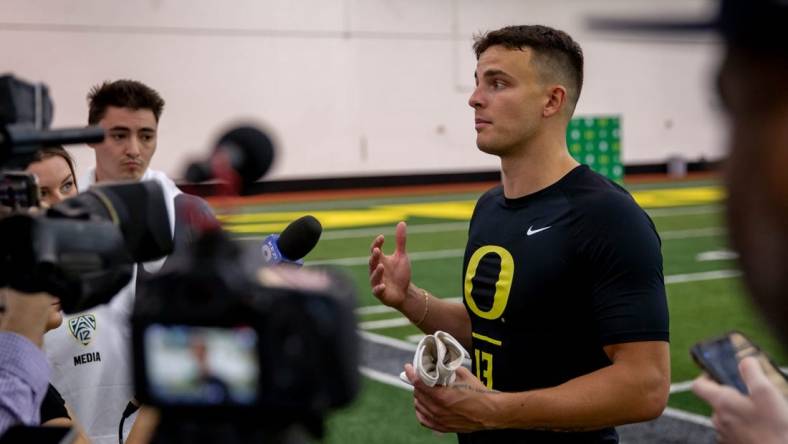 Devon Allen talks to reporters during Oregon Football   s Pro Day Friday, April 1, 2022, at the Moshofsky Center in Eugene Ore.