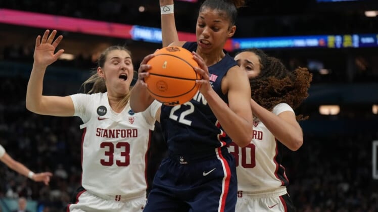 Apr 1, 2022; Minneapolis, MN, USA; UConn Huskies guard Evina Westbrook (22) battles for a rebound with Stanford Cardinal guard Hannah Jump (33) and Stanford Cardinal guard Haley Jones (30) during the second half in the Final Four semifinals of the women's college basketball NCAA Tournament at Target Center. Mandatory Credit: Kirby Lee-USA TODAY Sports