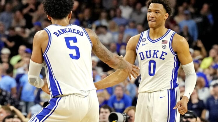 Apr 2, 2022; New Orleans, LA, USA; Duke Blue Devils forward Paolo Banchero (5) and forward Wendell Moore Jr. (0) celebrates after a play during the second half against the North Carolina Tar Heels in the 2022 NCAA men's basketball tournament Final Four semifinals at Caesars Superdome. Mandatory Credit: Robert Deutsch-USA TODAY Sports