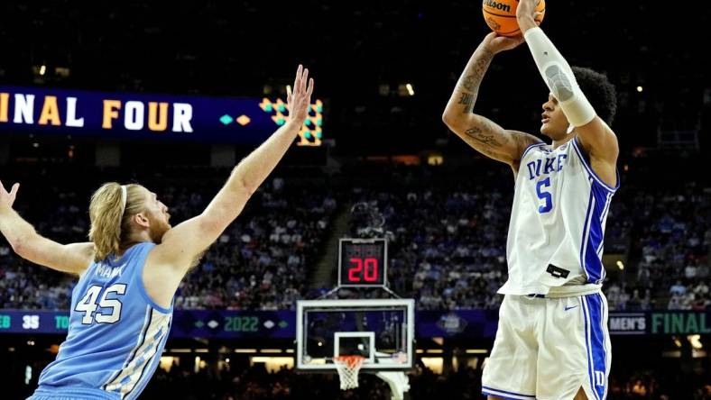 Apr 2, 2022; New Orleans, LA, USA; Duke Blue Devils forward Paolo Banchero (5) shoots the ball against North Carolina Tar Heels forward Brady Manek (45) in the 2022 NCAA men's basketball tournament Final Four semifinals at Caesars Superdome. Mandatory Credit: Robert Deutsch-USA TODAY Sports