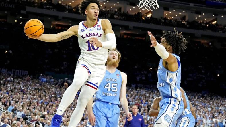 Apr 4, 2022; New Orleans, LA, USA; Kansas Jayhawks forward Jalen Wilson (10) drives to the basket against North Carolina Tar Heels forward Brady Manek (45) during the 2022 NCAA men's basketball tournament Final Four championship game at Caesars Superdome. Mandatory Credit: Robert Deutsch-USA TODAY Sports