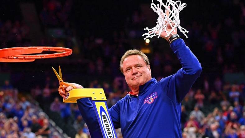 Apr 4, 2022; New Orleans, LA, USA; Kansas Jayhawks head coach Bill Self reacts after cutting down the net after their win against the North Carolina Tar Heels in the 2022 NCAA men's basketball tournament Final Four championship game at Caesars Superdome. Mandatory Credit: Bob Donnan-USA TODAY Sports