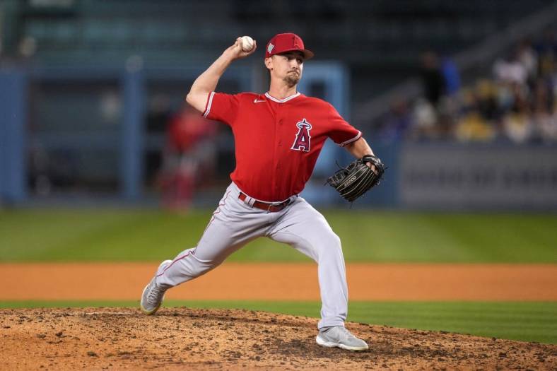 Apr 5, 2022; Los Angeles, California, USA; Los Angeles Angels relief pitcher Austin Warren (61) delivers a pitch against the Los Angeles Dodgers at Dodger Stadium. Mandatory Credit: Kirby Lee-USA TODAY Sports