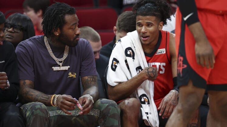 Apr 10, 2022; Houston, Texas, USA; Houston Rockets guard Jalen Green (0) talks with guard John Wall (left) during the second quarter against the Atlanta Hawks at Toyota Center. Mandatory Credit: Troy Taormina-USA TODAY Sports