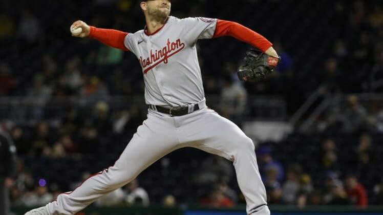 Apr 15, 2022; Pittsburgh, Pennsylvania, USA;  Washington Nationals relief pitcher Austin Voth (50) pitches against the Pittsburgh Pirates during the seventh inning at PNC Park. Mandatory Credit: Charles LeClaire-USA TODAY Sports