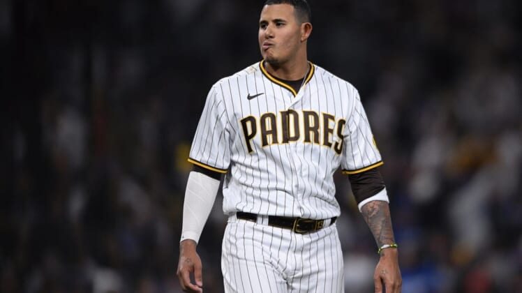 Apr 22, 2022; San Diego, California, USA; San Diego Padres third baseman Manny Machado (13) reacts after striking out to end the fifth inning against the Los Angeles Dodgers at Petco Park. Mandatory Credit: Orlando Ramirez-USA TODAY Sports