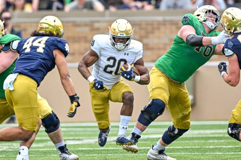 Apr 23, 2022; Notre Dame, Indiana, USA; Notre Dame Fighting Irish running back Jadarian Price (20) carries in the first quarter of the Blue-Gold Game at Notre Dame Stadium. Mandatory Credit: Matt Cashore-USA TODAY Sports