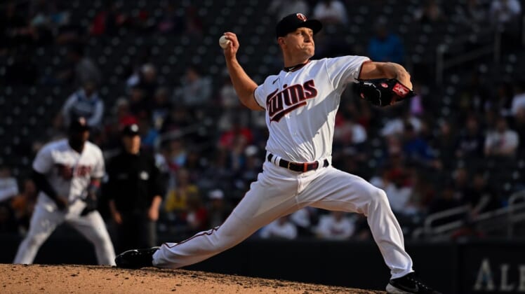 Apr 23, 2022; Minneapolis, Minnesota, USA;  Minnesota Twins relief pitcher Cody Stashak (61) delivers a pitch against the Chicago White Sox during the sixth inning at Target Field. Mandatory Credit: Nick Wosika-USA TODAY Sports
