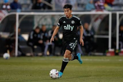 Apr 23, 2022; Commerce City, Colorado, USA; Charlotte FC midfielder Alan Franco (21) controls the ball in the first half against the Colorado Rapids at Dick's Sporting Goods Park. Mandatory Credit: Isaiah J. Downing-USA TODAY Sports